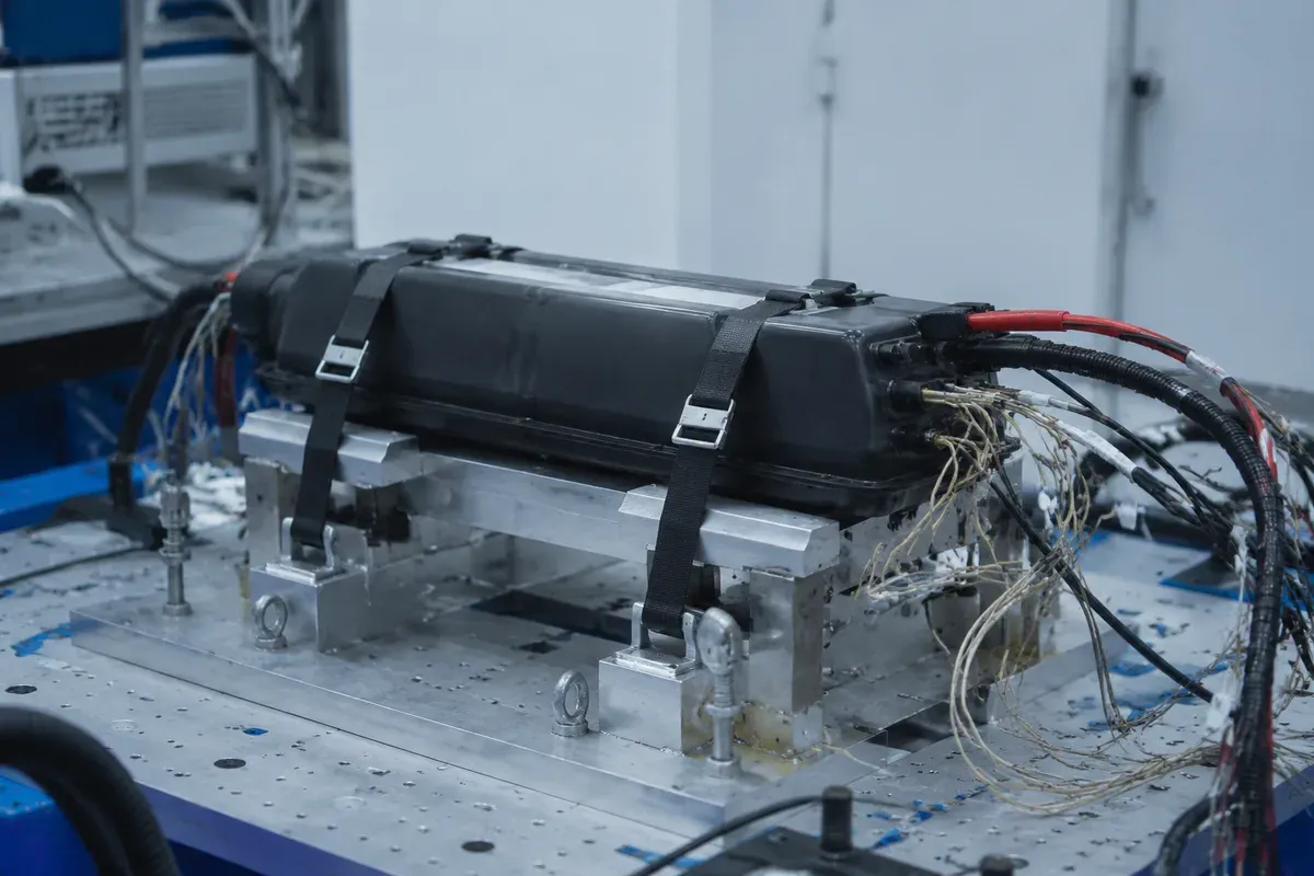 Light electric vehicle battery pack on a North American safety test fixture