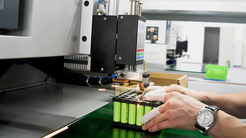 Lithium battery cells being spot welded during pack manufacturing