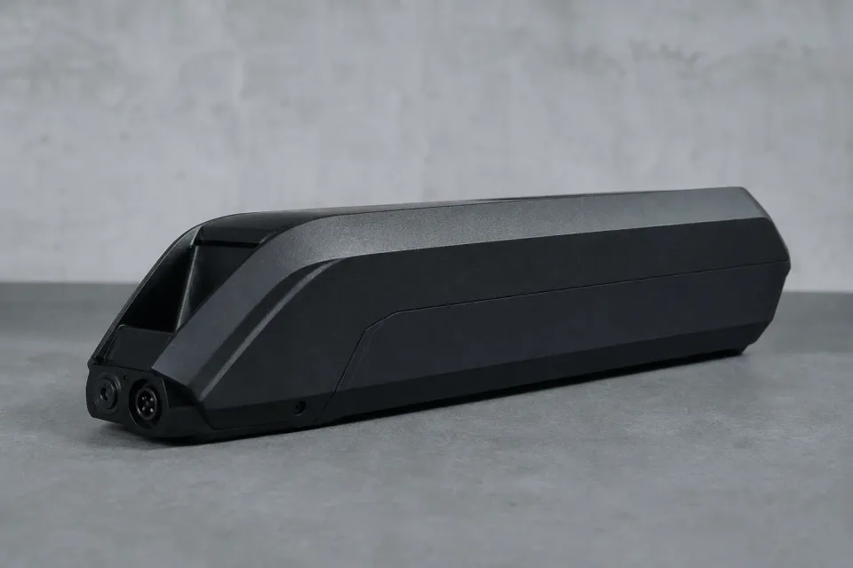 Close documentary still of an e-bike battery pack on a clean display surface