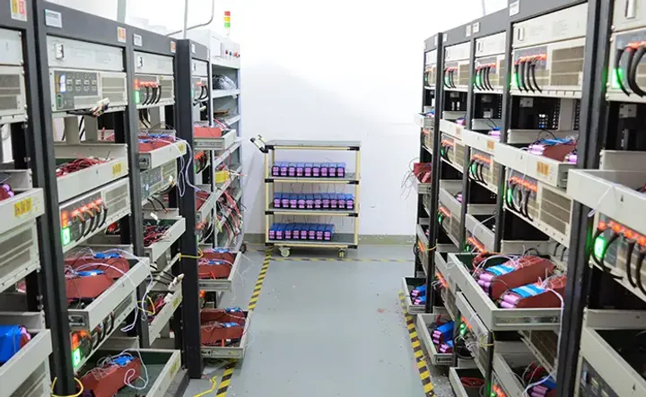 Rows of e-bike battery packs connected on aging test racks